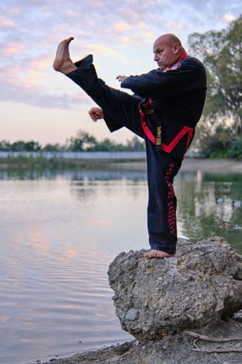 A vertical shot of Sipalkido master practicing in nature.