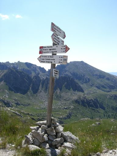 A mesmerizing view of a beautiful mountainous landscape with signs in the foreground