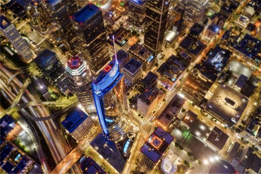 An aerial shot of Los Angeles covered in the lights at night in the US