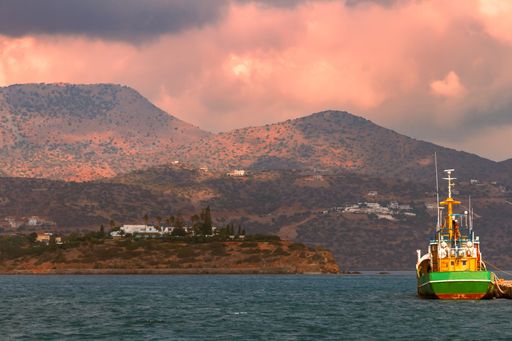 A fishing boat in the port of Agios Nikolaos on the island of Crete, Greece