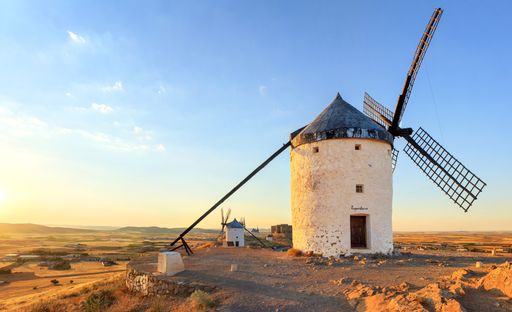 Traditional Spanish windmills near Consuegra, in the La Mancha region of Spain at sunset