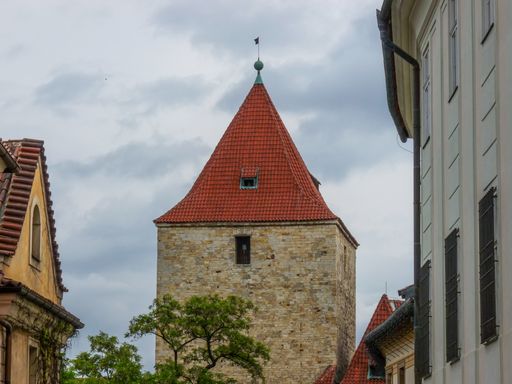The Black Tower under a cloudy sky in the daylight in Prague, the Czech Republic