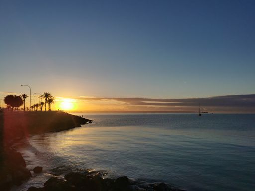 A beautiful view of the beach on the sunset in Palma de Mallorca, Balearic Islands, Spain