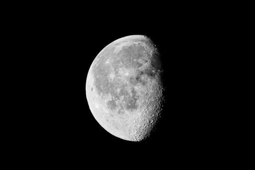 A closeup shot of waxing gibbous moon isolated on black background