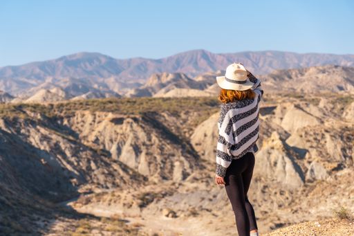 A young female hiker in the mountain desert of Tabernas, Almeria province, Andalusia