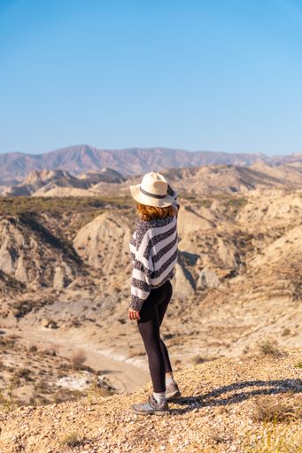 A young female hiker in the mountain desert of Tabernas, Almeria province, Andalusia