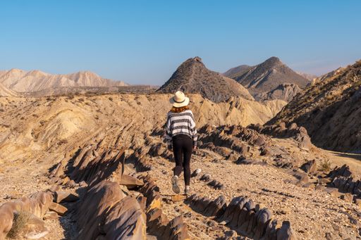 A young female hiker on the desert of Tabernas, Almeria province, Andalusia