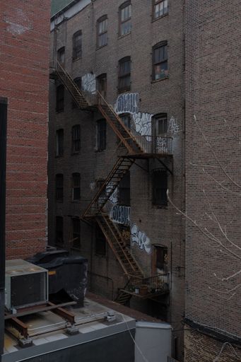 A vertical shot of an old abandoned building in New York, the United States