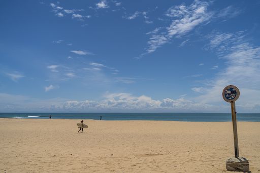 A landscape of the beach surrounded by the sea under the sunlight at daytime in Andalusia, Spain