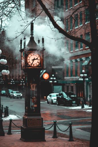 Vancouver steam clock letting of steam as it whistles in Vancouver's Victorian Gastown Westminster Chime