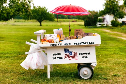 A farm stand selling goods in a park