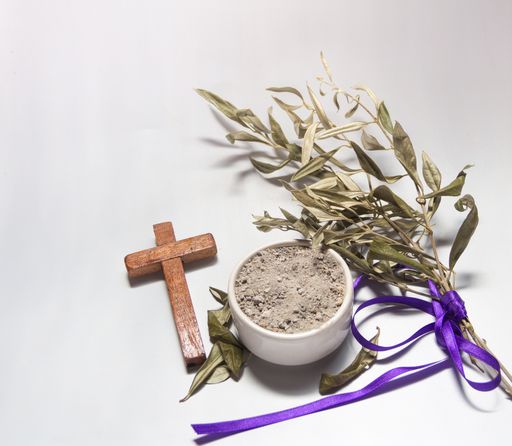 Bowl with ashes, olive branch and cross, symbols of Ash Wednesday