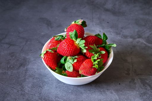 A top view of strawberries on a marble table