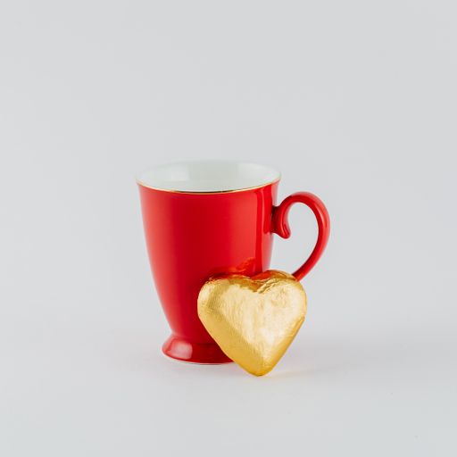 A closeup shot of Valentine's day decorations on a white background