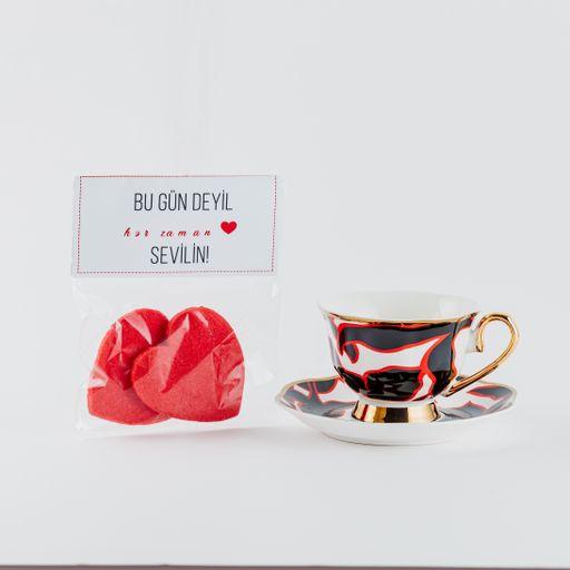 A closeup shot of Valentine's day decorations on a white background