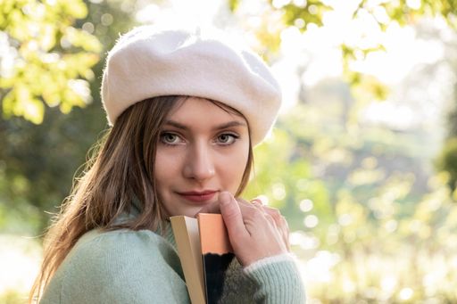 A photo of a Caucasian young lady outdoors during winter time on a sunny day