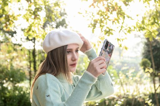 A photo of a Caucasian young lady outdoors during winter time on a sunny day