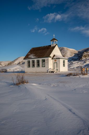 Winter at the old wooden pioneer church in the ghost town of Dorothy in Alberta, Canada