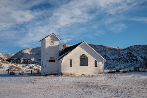 Winter at the old wooden pioneer church in the ghost town of Dorothy in Alberta, Canada
