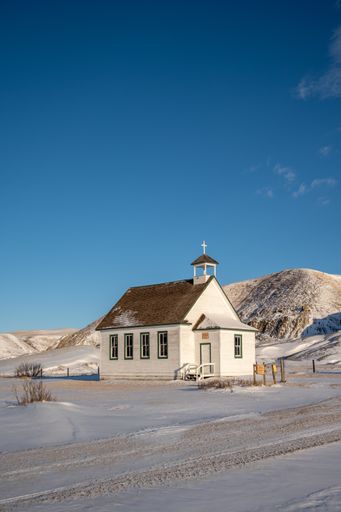 Winter at the old wooden pioneer church in the ghost town of Dorothy in Alberta, Canada