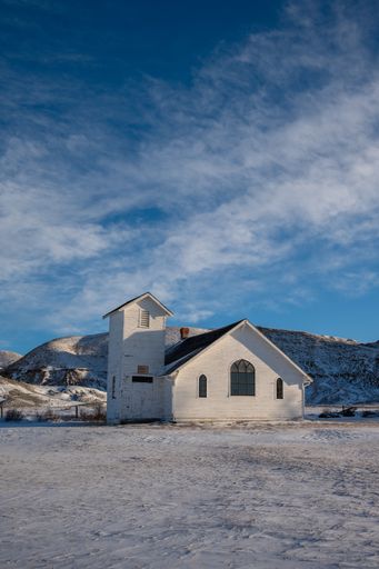 Winter at the old wooden pioneer church in the ghost town of Dorothy in Alberta, Canada