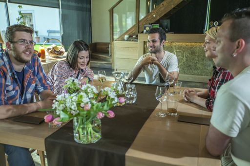 A group of happy friends having drinks and snacks in a cafe