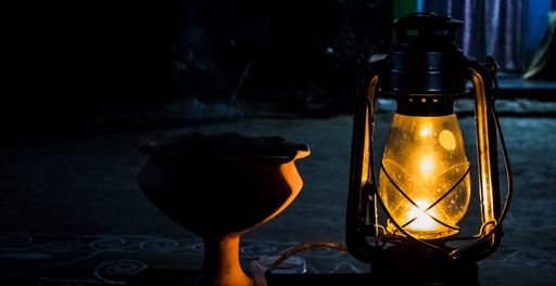 A village lamp and the dhupdani in makar sankranti night of a village