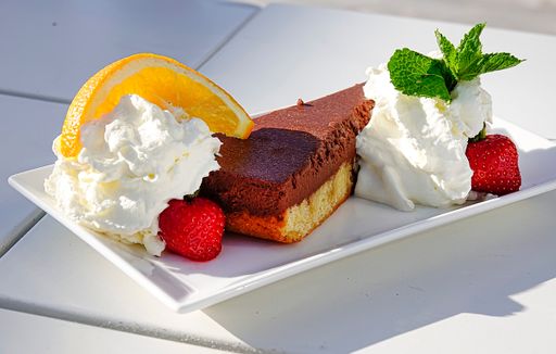 An appetizing cake with cream and strawberries