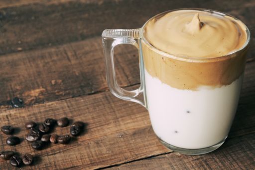 A closeup shot of iced Dalgona Coffee, fluffy creamy whipped coffee.