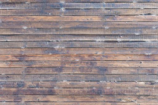 A background of dark wooden slats
