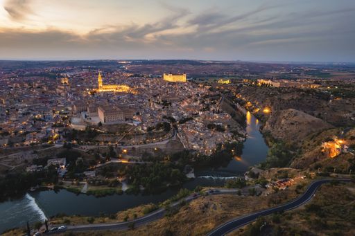 A breathtaking view of Toledo and Tagus river at dusk. Famous places and landmarks in Spain