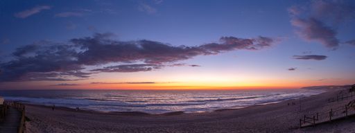 A panoramic shot of a colorful breathtaking sunset over the ocean
