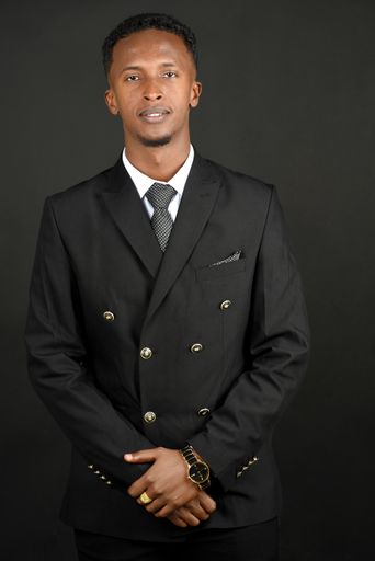 A vertical shot of a black guy wearing a luxury suit on a dark background