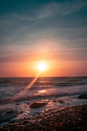 A vertical shot of a sunset above the Baltic Sea