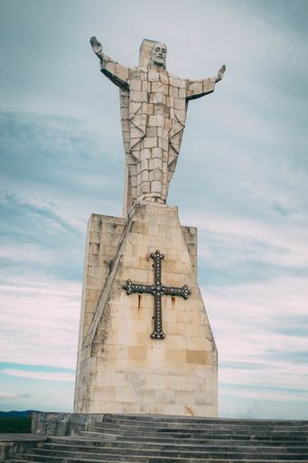 A vertical low angle shot of Sagrado Corazon Constante Monument in Spain