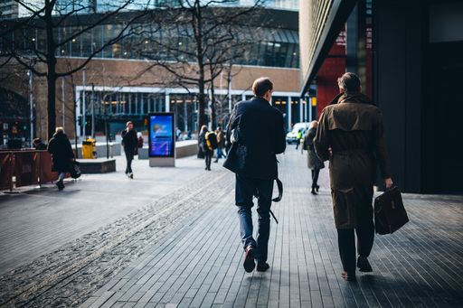 A view of people walking down London Bridge street