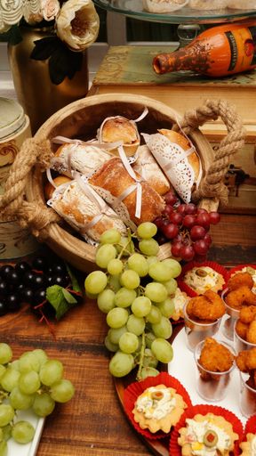 The tasty food with grapes on the  stand-up meal in the party