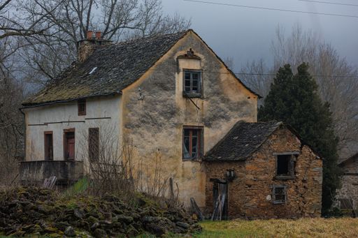 A lonely abandoned house in the foggy weather.