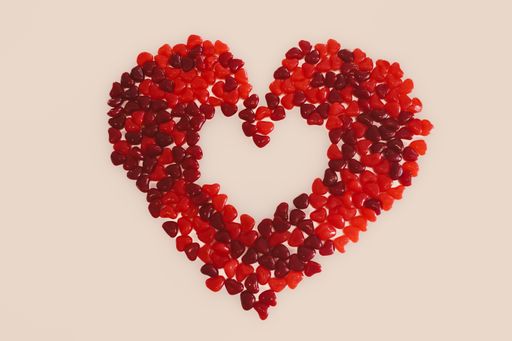 A closeup of heart-shaped small candies