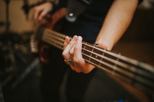 A closeup of a musician playing guitar