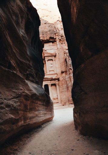 A vertical shot of the historic Petra Wadi in Jordan seen behind the huge rocks
