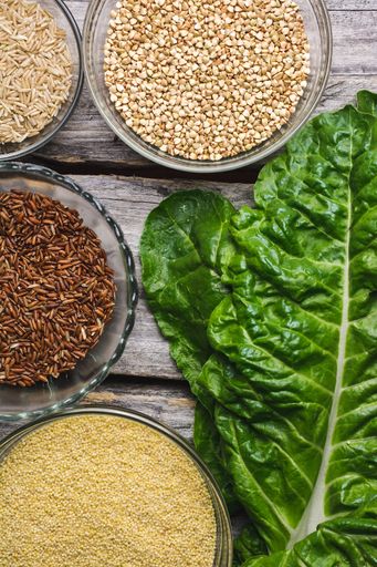A close up shot of various types of  fresh grains in small glass bowls