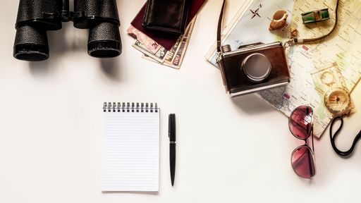 A Top View vintage Map for planning a trip or vacation with scattered items with copy space.