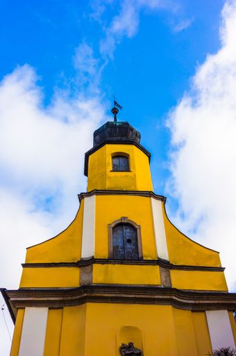 Top of a yellow orthodox church in the city center.
