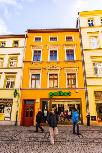 A vertical shot of  Galbut clothing store on a commercial shopping promenade in the city center.