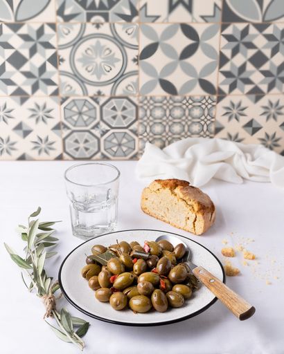 A closeup of olives in the plate