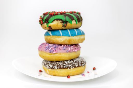 A plate of donuts isolated on a white background