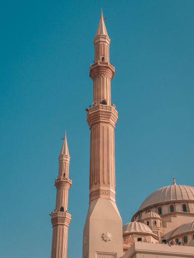 The Al Maghfirah Mosque in UAE with its domes and towers under the clear sky