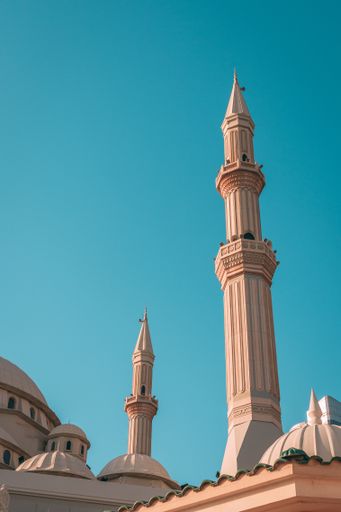 The Al Maghfirah Mosque in UAE with its domes and towers under the clear sky