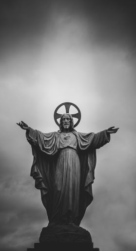 A grayscale photograph of Jesus Christ statue